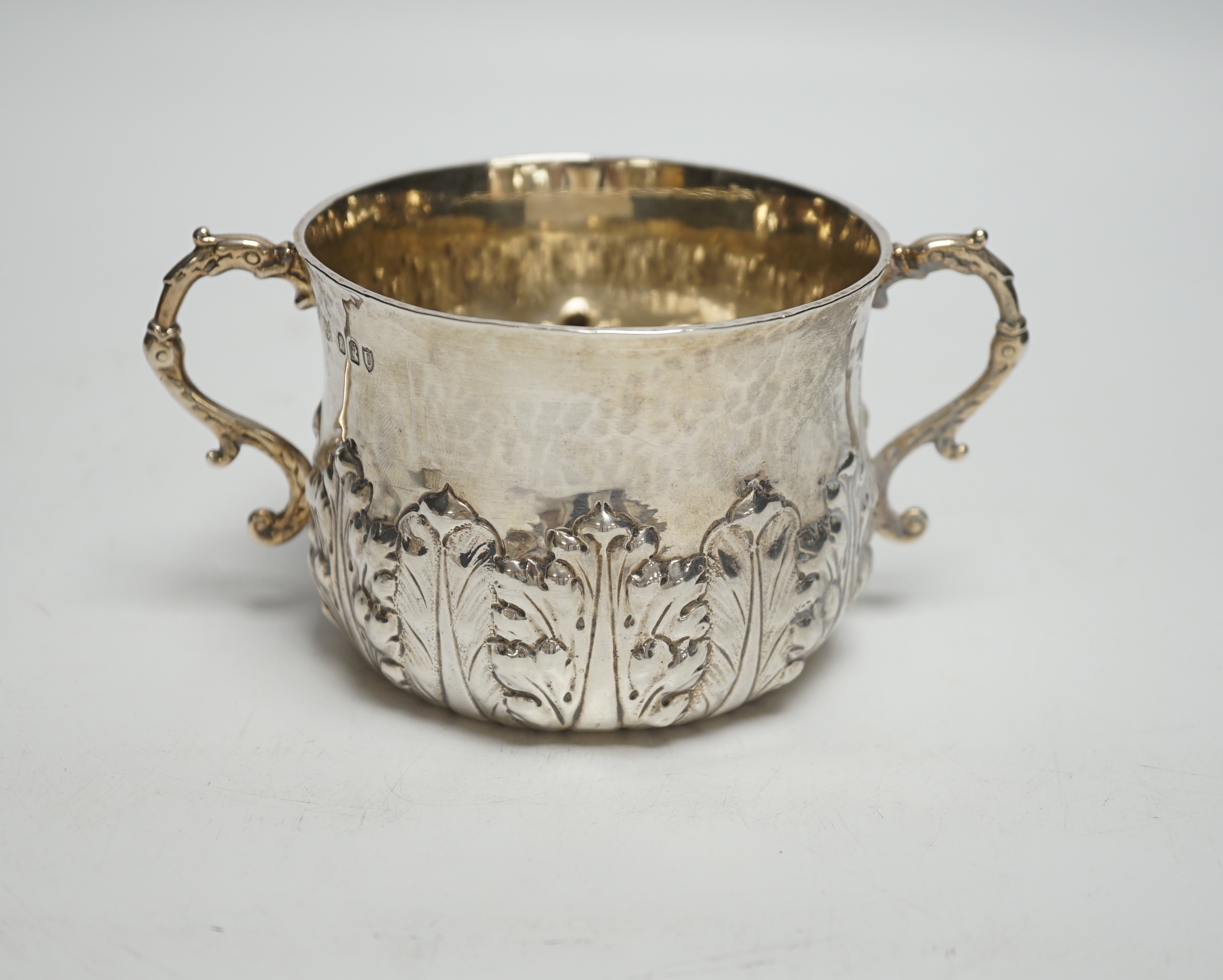 A late Victorian Britannia standard silver porringer with foliate decoration, Lambert & Co, London, 1895, with engraved inscription, 5.7oz.